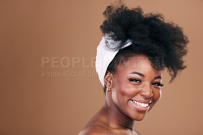 Buy stock photo Beauty, hair and face with a model black woman in studio on a brown background for natural cosmetics. Smile, skincare and haircare with a happy young afro female person indoor for shampoo treatment