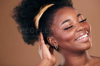 Buy stock photo Beauty, hair and smile with a model black woman in studio on a brown background for natural cosmetics. Face, makeup and haircare with a happy young afro female person indoor for shampoo treatment