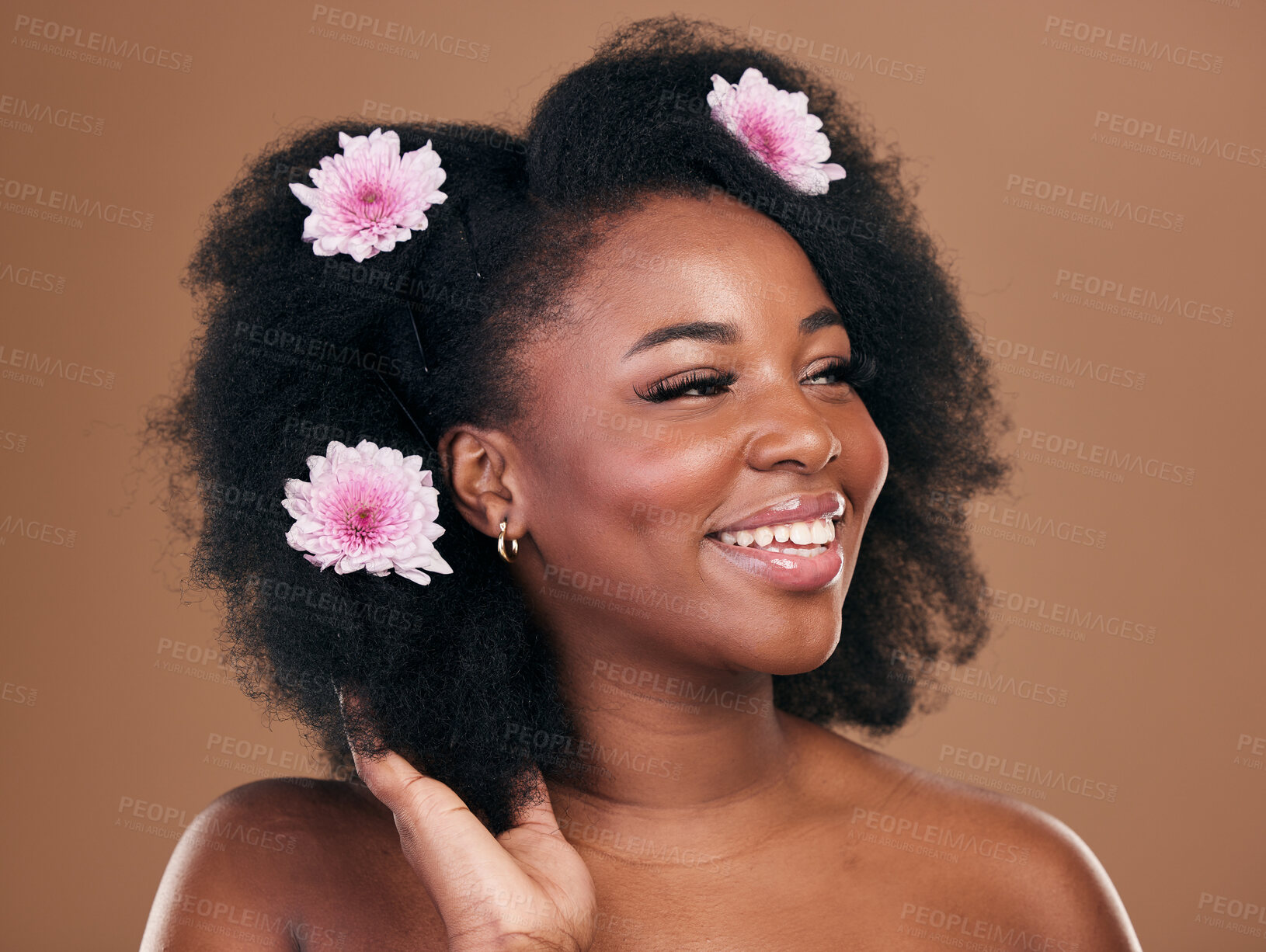 Buy stock photo Hair care, flowers and black woman, afro and thinking in studio isolated on a brown background. Happy, floral cosmetics and natural African model in organic salon treatment, wellness and hairstyle
