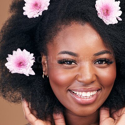 Buy stock photo Face, flowers and black woman in afro hair care, happy and beauty in studio isolated on a brown background. Portrait, floral hairstyle cosmetics and natural African model in organic salon treatment