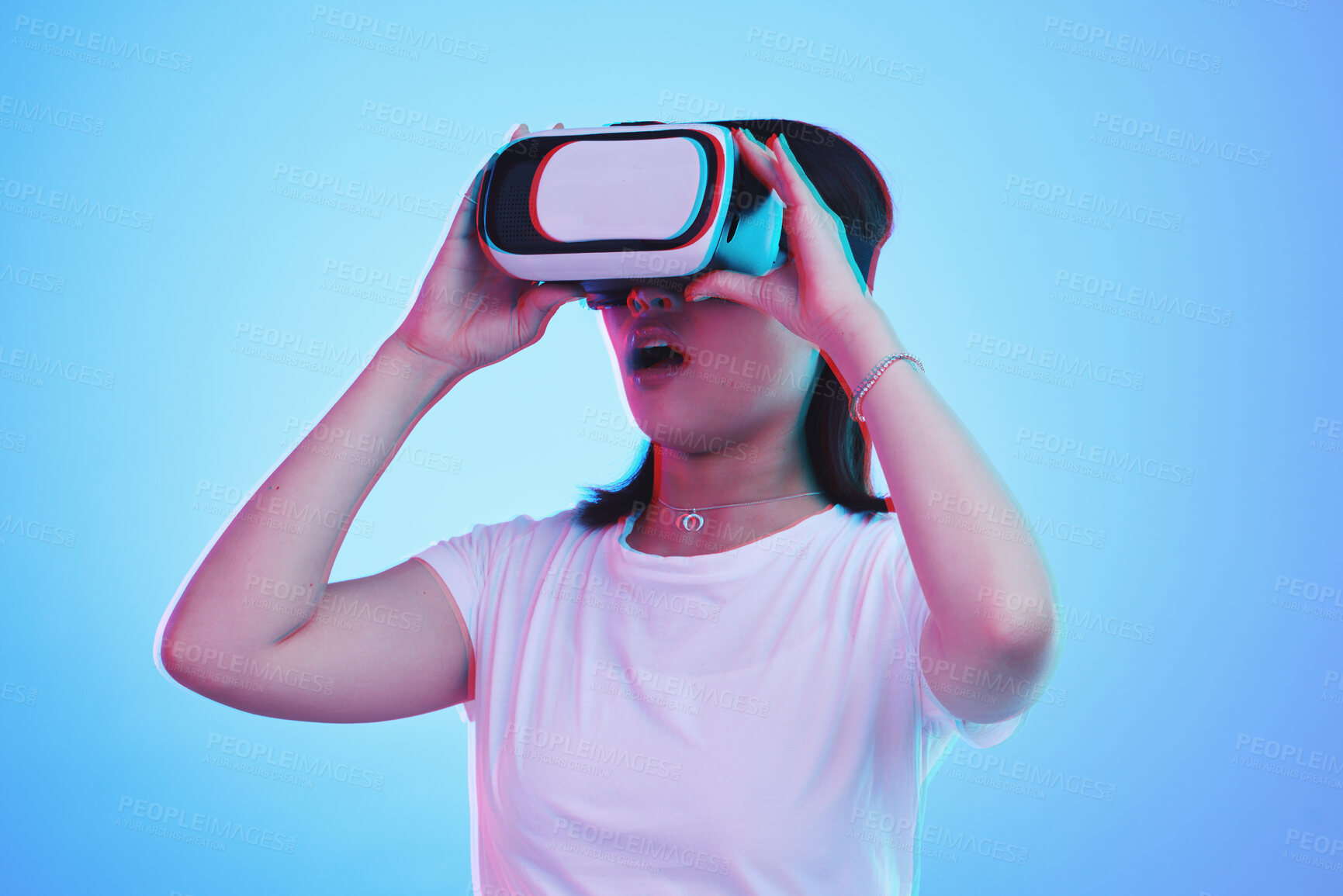 Buy stock photo Woman, VR and glasses with wow in futuristic experience, 3d games and gen z education or digital e learning. Young person or student in virtual reality, high tech and vision on blue studio background