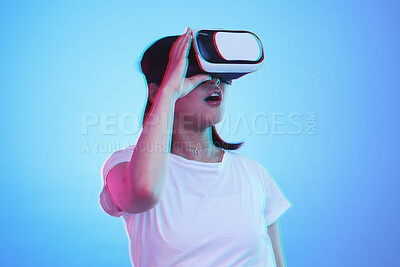 Buy stock photo Woman, VR and vision with wow for futuristic experience, 3d games and gen z education or digital e learning. Student with surprise for virtual reality, high tech and glasses on blue studio background