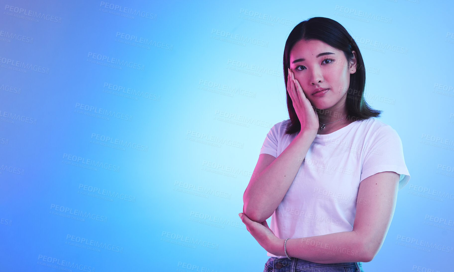 Buy stock photo Mockup, neon and portrait of Asian woman in studio for information, promotion and deal on blue background. Creative lighting, marketing and isolated person with space for news, announcement and sale