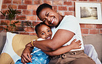 Portrait, mother and daughter on sofa with hug, smile and relax bonding in living room together. Love, mom and girl child on couch in house, happy embrace and support, trust and black woman with kid