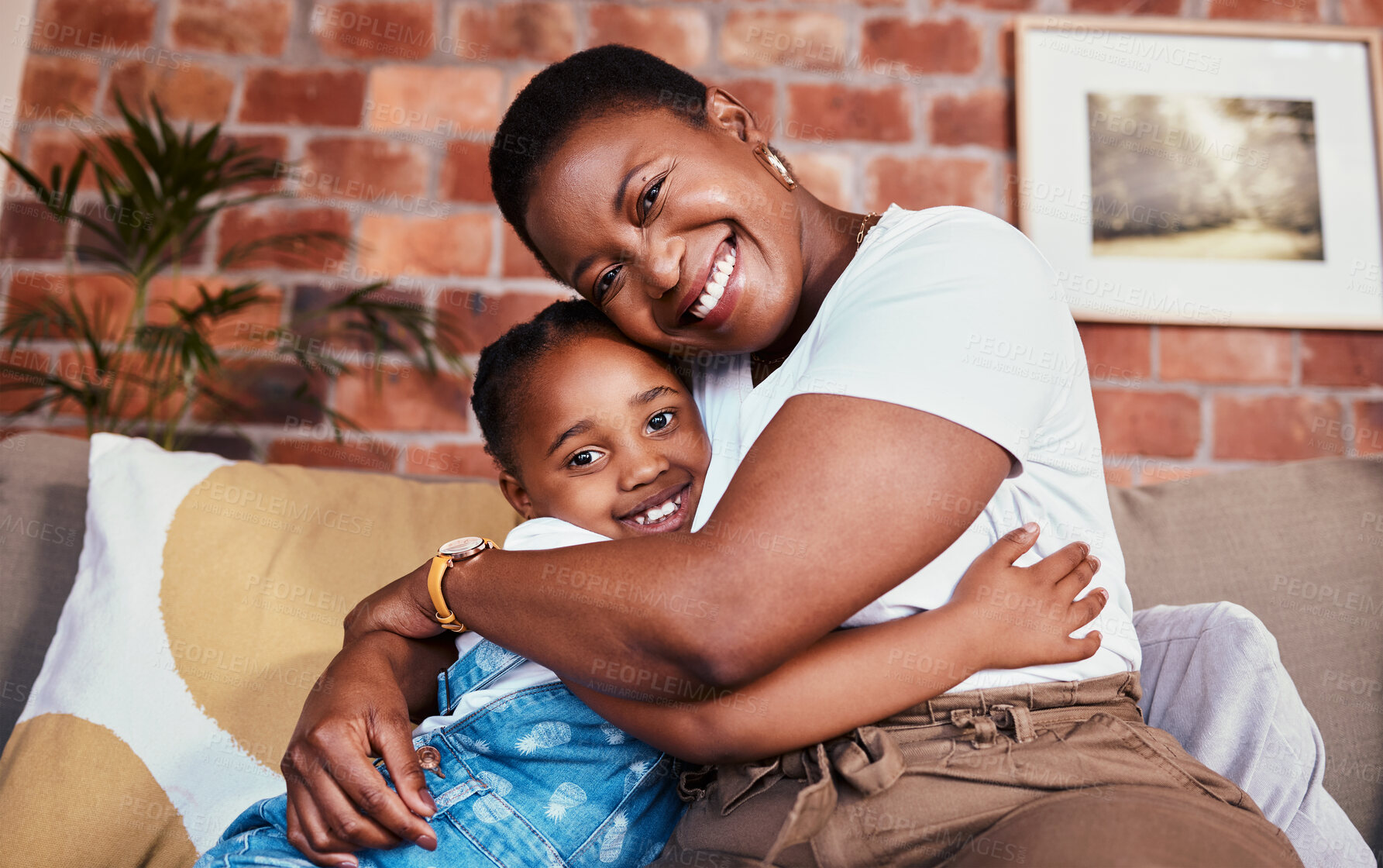 Buy stock photo Portrait, mother and daughter on sofa with hug, smile and relax bonding in living room together. Love, mom and girl child on couch in house, happy embrace and support, trust and black woman with kid