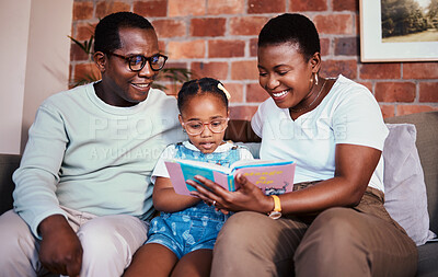 Buy stock photo Family, happy and reading a book on a home sofa with glasses for learning, knowledge and time together. A man, woman and girl kid in a lounge with love, care and happiness with a story in house 