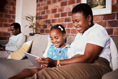 Buy stock photo Happy, learning and a mother with a tablet and a child for a cartoon, movies or games on the sofa. Smile, reading and an African family, mom or girl kid with technology for social media in a house