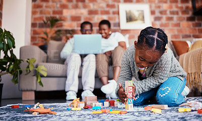 Buy stock photo Playing, house and a child with building blocks and parents on the sofa with a laptop and relax. Happy, black family and a girl kid with toys on the lounge floor for education, learning and a game