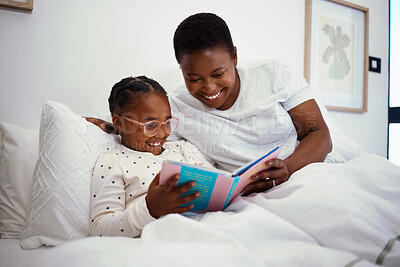 Buy stock photo Relax, storytelling and book with mother and daughter in bedroom for education, fantasy and bedtime. Happy, learning and reading with woman and child in bed of black family home for knowledge