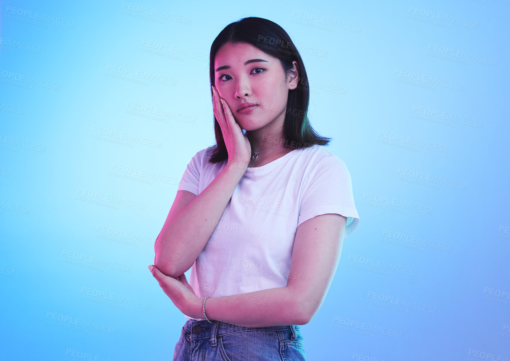 Buy stock photo Fashion, neon and portrait of Asian woman in studio for style, promotion and retail sale on blue background. Creative lighting, beauty and isolated Japanese person in trendy, casual and cool clothes