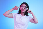 Portrait, thinking and Asian woman with glasses, ideas and opportunity on a blue studio background. Japanese person, face and model with eyewear, solution and decision with problem solving and choice