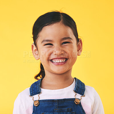 Buy stock photo Happy, portrait and girl child with smile in studio for confidence, excited and positive attitude. Face, teeth and young kid from Mexico with happiness, pose and youth isolated on a yellow background