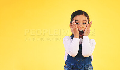 Buy stock photo Portrait, fashion and hands on face of girl child in studio with deal, sale or giveaway promo on yellow background. Excited, surprise and open mouth kid with emoji for news, announcement or wow info