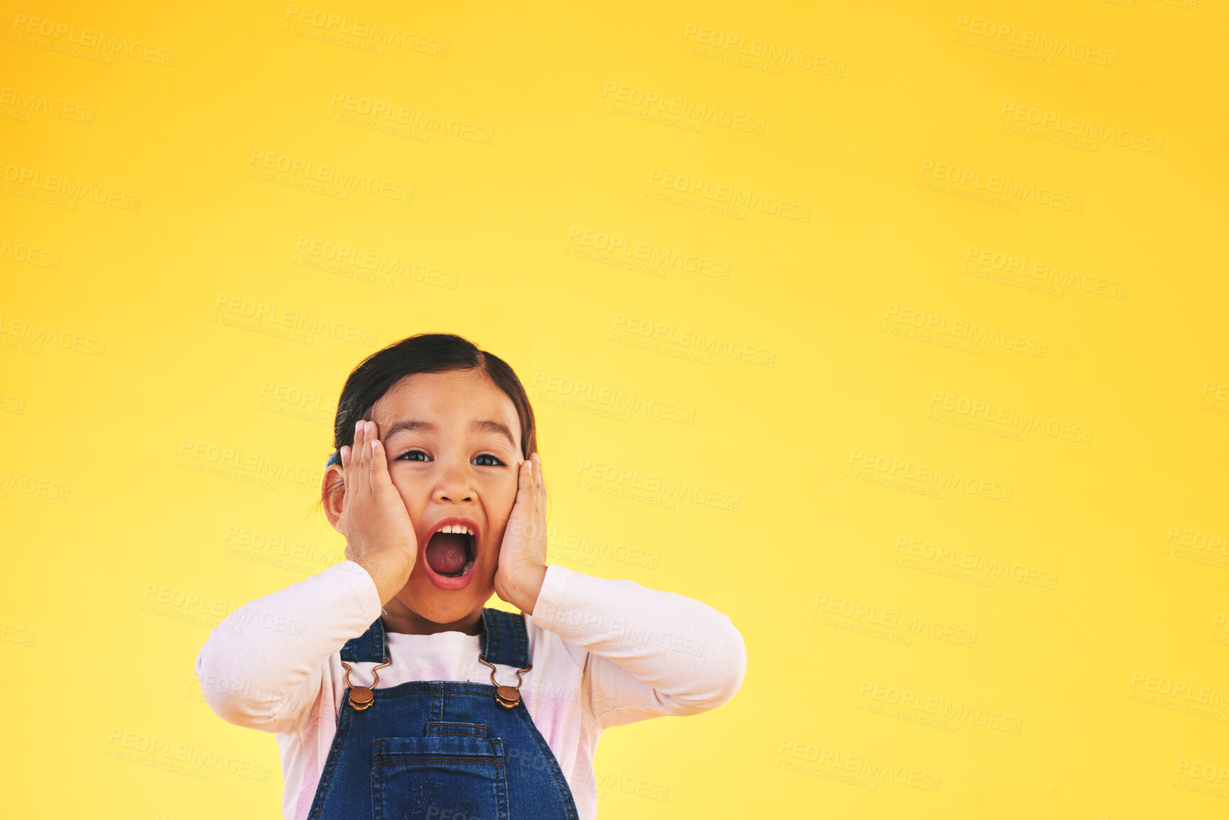 Buy stock photo Wow, fashion and hands on face of girl child in studio with deal, sale or giveaway promo on yellow background. Excited, surprise and open mouth kid with emoji for news, announcement or competition