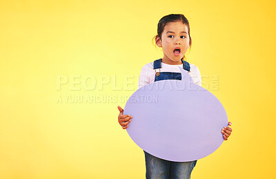 Buy stock photo Girl kid, thinking and speech bubble in studio with wow, news and mockup space by yellow background. Young female child, poster or sign for promotion, review and opinion with vote for social media