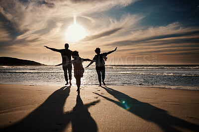 Buy stock photo Family, running and silhouette on beach with sunset, freedom and fun together, games and bonding on vacation. Travel, adventure and playful, parents and child with happy people in nature and energy