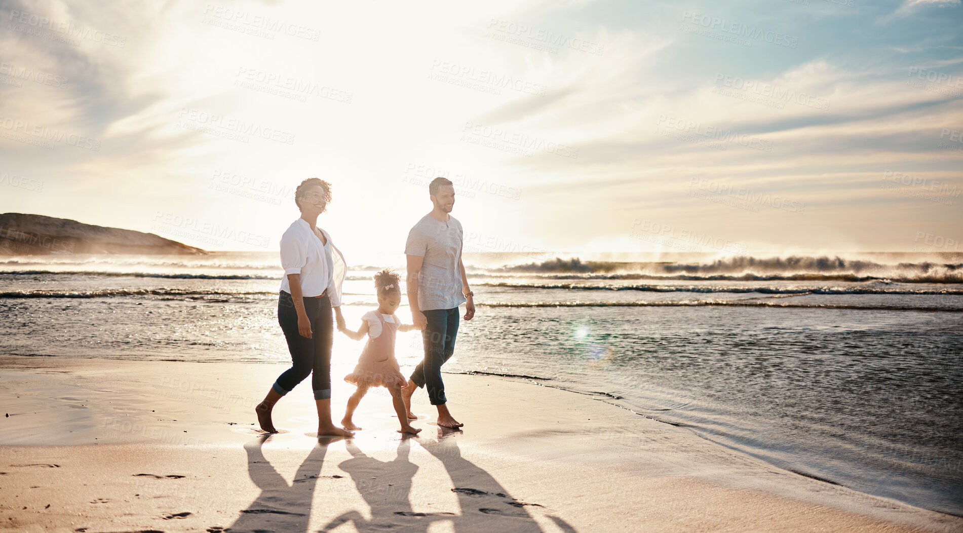 Buy stock photo Beach, sunset and family holding hands, walking and bond, relax and happy on vacation in nature together. Travel, love and girl chid with parents at ocean with freedom, adventure or journey in Bali
