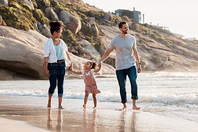 Buy stock photo Family, beach and holding hands, parents and child with travel and bonding, love and walking together outdoor. Vacation, ocean and happy people in nature, man and woman with kid, sun and adventure 