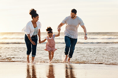 Buy stock photo Family, running and ocean, beach and sunset, happiness and fun together with games and bonding on vacation. Travel, adventure and playful, parents and child, happy people in nature and holding hands