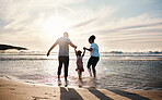 Family play in ocean, beach and holding hands, parents and girl child with back view, fun in the sun and bonding outdoor. Happy people, freedom and adventure, splash in water and tropical holiday