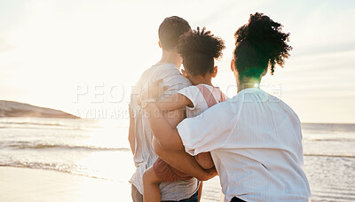 Buy stock photo Family, beach and watching sunset, travel and bonding, love with back view and together outdoor. Vacation, ocean and people in nature, man and woman with kid, sunshine and adventure with peace