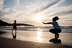 Child is running to mother, beach and silhouette, family with games and love, travel and freedom together outdoor. People, sunset and adventure, woman and girl bonding on tropical holiday and nature