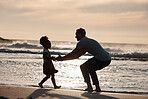 Sunset, beach and silhouette of father with girl child in nature, bond and playing, freedom and enjoying summer vacation. Ocean, shadow and kid hug parent at sea with love, care and embrace in Bali
