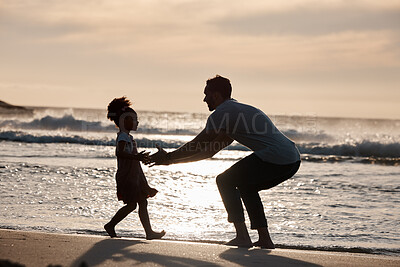 Buy stock photo Sunset, beach and silhouette of father with girl child in nature, bond and playing, freedom and enjoying summer vacation. Ocean, shadow and kid hug parent at sea with love, care and embrace in Bali