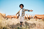 Farm, cows and portrait of child in countryside for ecology, adventure and agriculture in field. Childhood, sustainable farming and happy kid with arms open for freedom, relax or learning with cattle