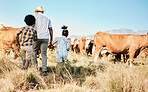 Farm, family and cow, agriculture and livestock with man and kids, sustainability and agro business in countryside. Farmer, children and walk in field, environment and cattle animal outdoor with back