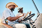 Game drive, safari and men talk with tablet for direction in Kenya desert with car for travel transport. Holiday, tour guide and driving with tech for adventure, holiday and journey with employees