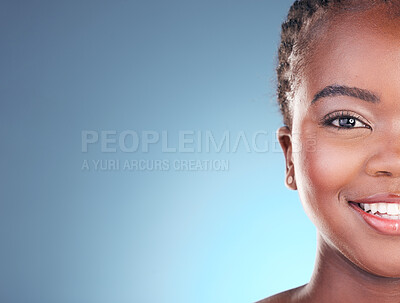 Buy stock photo Portrait of black woman with mockup space for skincare, beauty and smile on blue background. Spa aesthetic, dermatology and half face of person in studio with cosmetics, makeup and glow for wellness