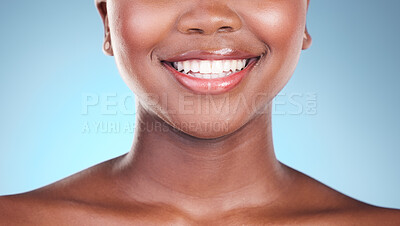 Buy stock photo Woman, teeth and smile in dental care, hygiene or treatment against a blue studio background. Closeup of female person mouth in tooth whitening, oral or gum healthcare or cleaning in healthy wellness