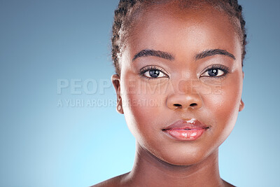 Buy stock photo Black woman, beauty and portrait with cosmetics, makeup and dermatology treatment. Studio, model face and African female person with skincare, facial and blue background with skin glow and care