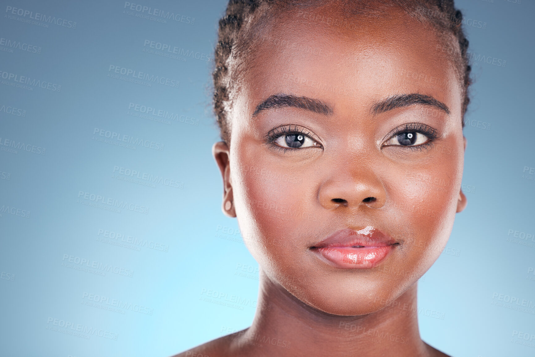 Buy stock photo Black woman, beauty and portrait with cosmetics, makeup and dermatology treatment. Studio, model face and African female person with skincare, facial and blue background with skin glow and care