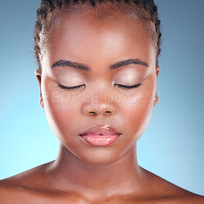 Buy stock photo Beauty, studio face and black woman relax with self care wellness, natural skincare or and facial makeup. Makeup cosmetics, spa salon and African person with eyes closed on blue gradient background