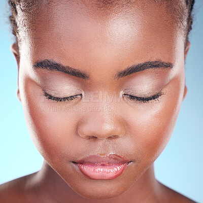 Buy stock photo Beauty eyeshadow, studio face and black woman relax with self care wellness, eyeliner cosmetics or eyebrow treatment. Makeup glow, spa salon and African person with eyes closed on blue background