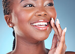 Face of black woman for makeup, beauty and lips on blue background for wellness, health and spa. Salon aesthetic, dermatology and closeup of happy person in studio with cosmetics, skincare and glow