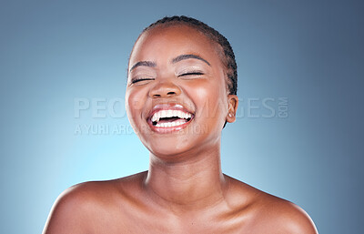 Buy stock photo Beauty, happy skincare and black woman with laughing, cosmetics and makeup in studio. Wellness, African female model and funny with blue background and skin glow with shine from dermatology treatment