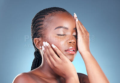 Buy stock photo Beauty, black woman and relax with skincare, cosmetics and  facial wellness in a studio. Blue background, makeup and dermatology with skin glow and shine from treatment with manicure and calm detox