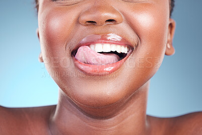 Buy stock photo Woman, lips or closeup tongue on dental teeth, blue background or studio of cosmetic veneers results. Emoji, model or fun facial expression in wellness, gum or clean mouth hygiene in grooming routine