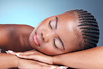 Skincare, relax and black woman in studio, sleeping and natural makeup with dermatology at luxury spa. Cosmetics, rest and dream facial beauty treatment with self care on blue background in Africa.