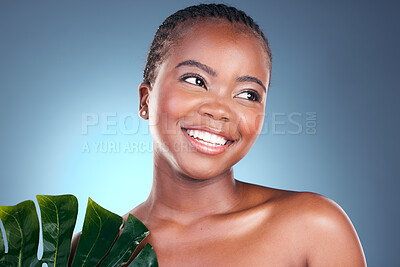 Buy stock photo Beauty, studio leaf and happy black woman with natural spa wellness, organic foundation or sustainable cosmetics. Eco product makeup, plant and African person face with monstera on blue background