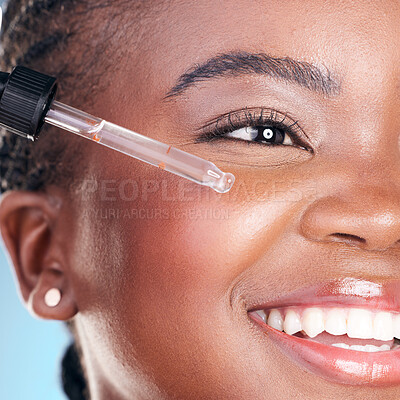 Buy stock photo Beauty, face and happy black woman with serum skin hydration, anti aging or collagen oil for studio skincare treatment. Retinol dropper, hyaluronic acid or closeup African person on blue background