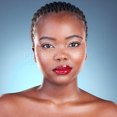 Buy stock photo Portrait, beauty and black woman with makeup, cosmetics and dermatology on a blue studio background. Face, African person and model with red lips, gloss and glow with aesthetic, shine and skincare