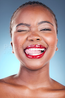 Buy stock photo Black woman, wink and flirt with red lipstick, beauty and makeup closeup with tongue out isolated on blue background. Model, bold and cosmetic product on lips, skin with shine and playful in studio