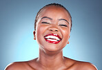 Portrait, funny and black woman with natural beauty, makeup and cosmetics on a blue studio background. Person, face and model with humor, smile and dermatology with skincare, wellness and aesthetic