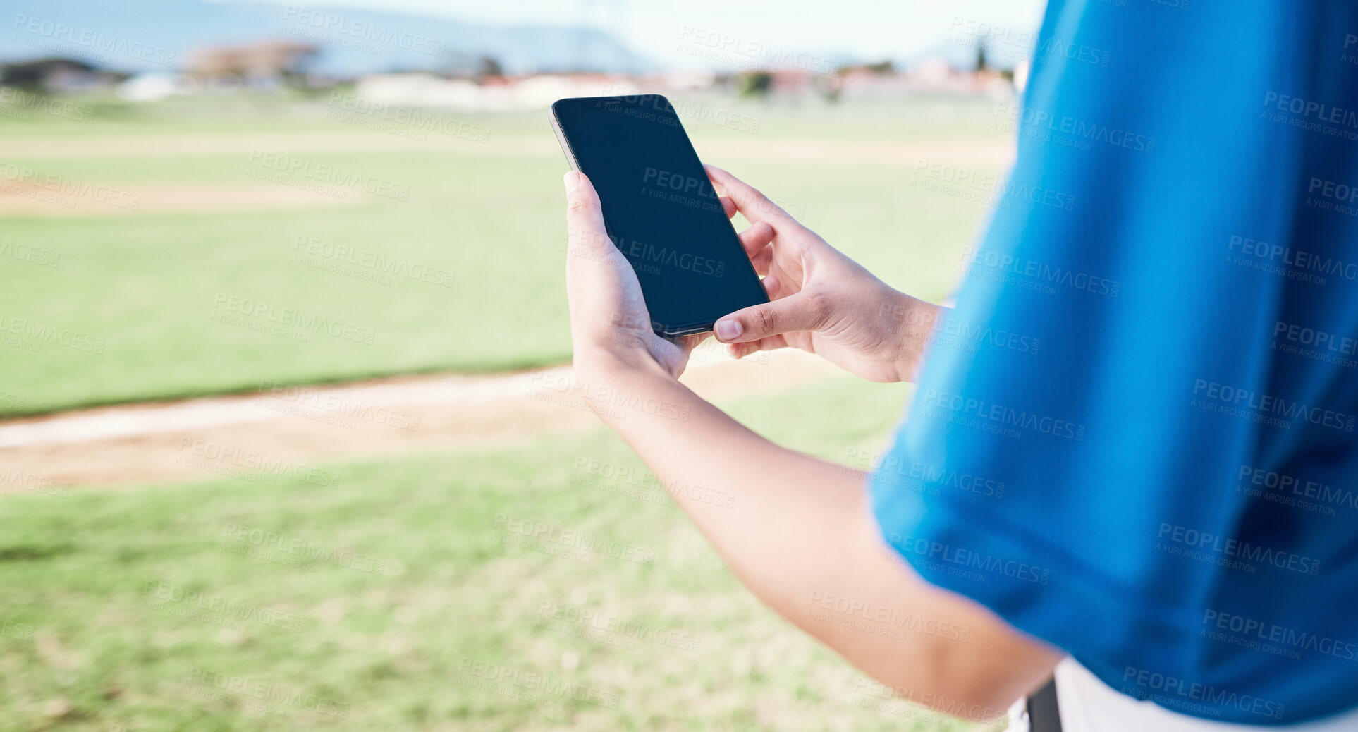 Buy stock photo App, field and person with a phone for baseball information, reading score or results after a game. Fitness, hands and an athlete with a mobile for training, connection or streaming a contest