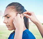 Hands, profile and woman in hearing aid, ear and sound amplifier at park outdoor. Help, person with a disability and deaf tools in audio communication, wear technology and listening on microphone