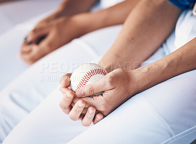 Hands, sports and baseball with a player in a dugout, waiting during a game of competition closeup. Ball, ready and uniform with an athlete holding equipment for a match in a stadium or venue